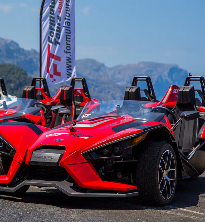 Formula Tours Mallorca convoy of Formula-style cars driving along the Mallorca coastline