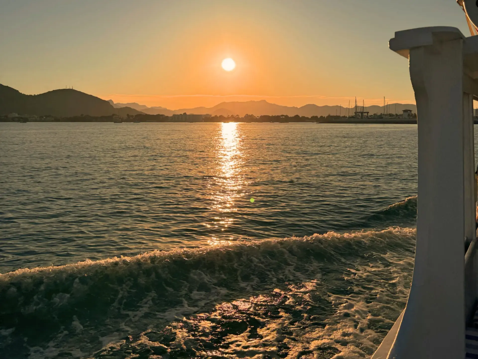 Guests swimming and snorkeling from Coral Boats Mallorca tour boat in a rocky cove