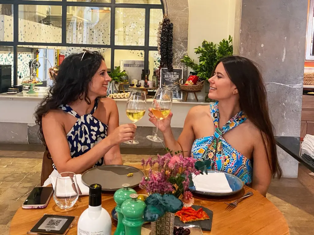 Group enjoying tapas and wine on self-guided food tour in Palma Old Town